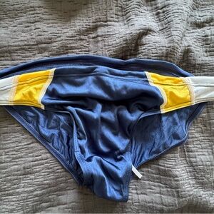 Men’s navy blue with white and yellow stripes brief swimwear. Aussie Bum. Large